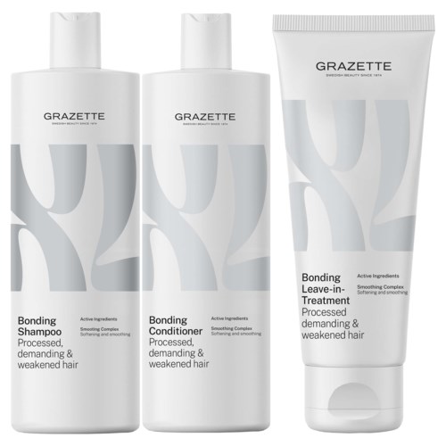 Drie haarverzorgingsproducten: een shampoo, een conditioner en een leave-in-behandeling, allemaal van Grazette met witte flessen.