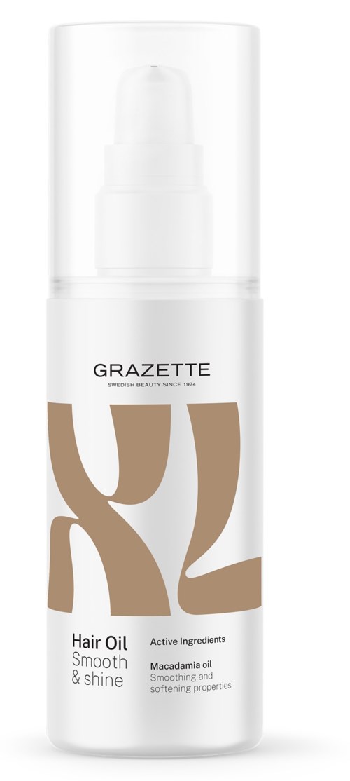 Een witte fles met pomp bevat GRAZETTE haarolie met bruin en zwart tekst en ontwerp.