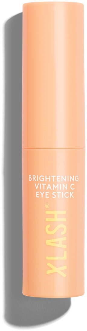 Een perzikkleurige oogstick met witte en gele tekst, gelabeld als een verhelderend vitamine C-oogproduct.