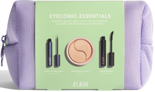 Schoonheidssetje met wimperserum, oogcrème en mascara in een paarse tas.