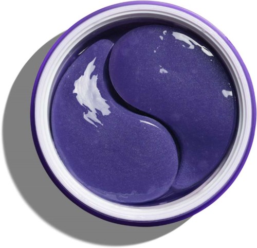 Een kleine container bevat paarse gel in yin-yang-vorm. De gel is glanzend en glad.