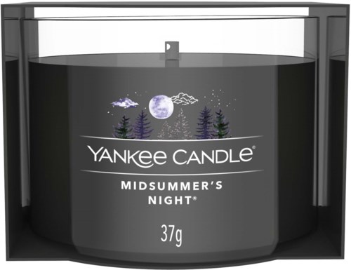 En svart ljusbehållare med en naturbild, måne och träd, märkt 'Yankee Candle Midsummer's Night 37g.'