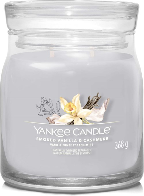 A clear candle jar with a label showing vanilla and cashmere scent, weighing 368 grams.