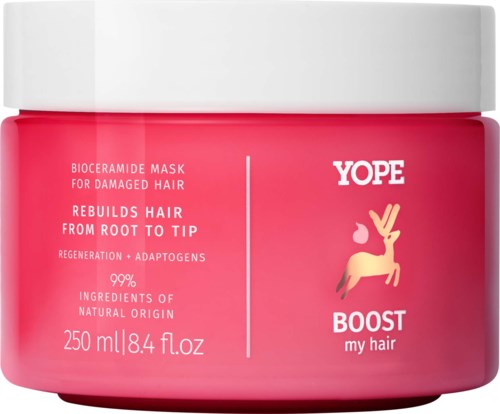A pink jar of YOPE Boost hair mask for damaged hair, containing natural ingredients, with a white lid and branding logo.