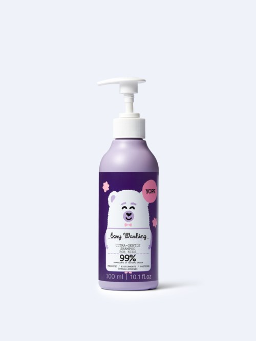 Violetti pullo hellävaraiseen kasvojenpesuun, jossa karhu-kuva ja pumpputoiminto.