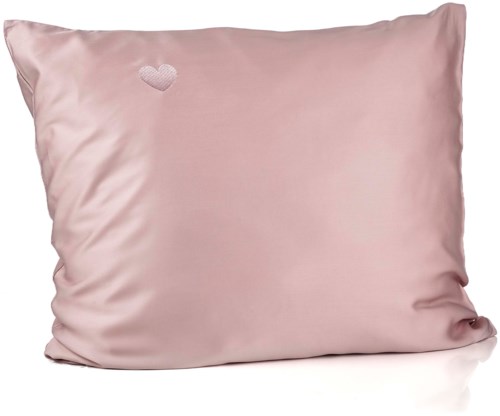 A pink satin pillow with a small embroidered heart in the top left corner.