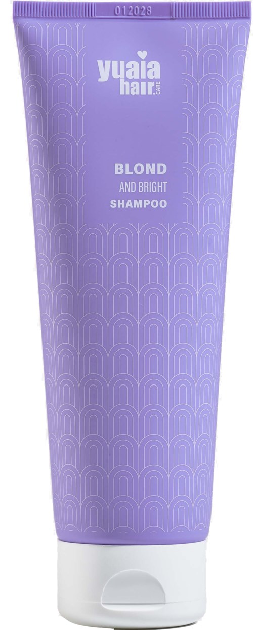 Purple shampoo tube labeled 'Yuaia Hair', for blond and bright hair. Simple design with wave-like pattern.