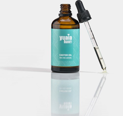 Ruskea pullo, jossa lukee "Yuaia Hair Castor Oil" ja mukana tippa-astiala.