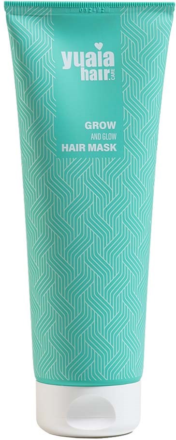 A teal tube of Yuja Hair GROW AND GLOW Hair Mask with a geometric pattern and white cap.