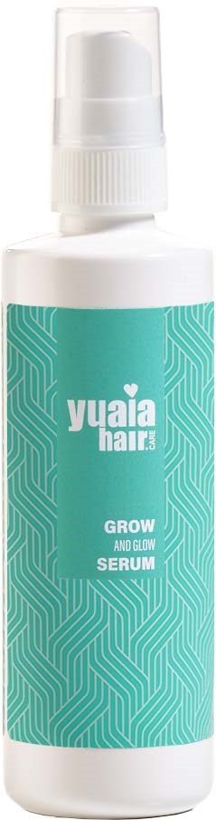 A white bottle with a blue label saying "Yuaia Hair Grow and Glow Serum." It has a spray pump at the top.