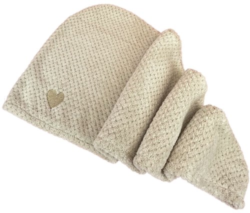 A cozy cream-colored knit hat with a small heart near the brim.