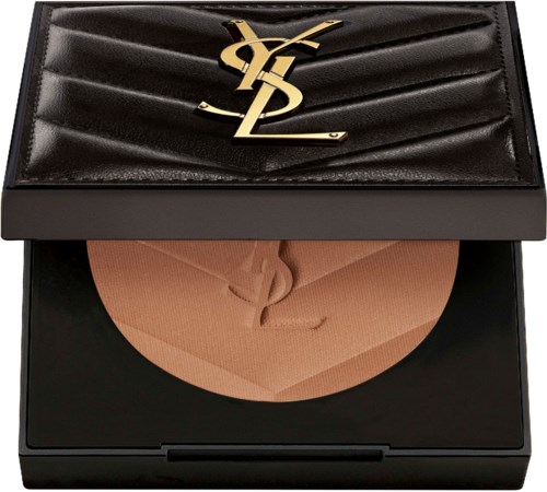 A black makeup case with a Yves Saint Laurent logo, open to show peach-colored powder inside.