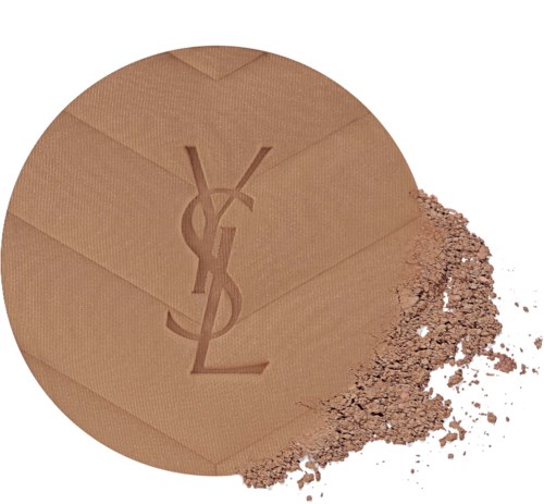 A round beige makeup powder compact with a YSL logo, with some loose powder spilled out.