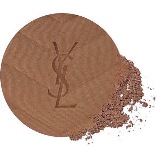 Brown YSL logo pressed powder with scattered powder on white background.