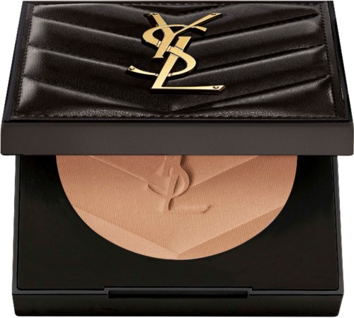 A black Yves Saint Laurent makeup compact with a gold logo and beige powder inside.