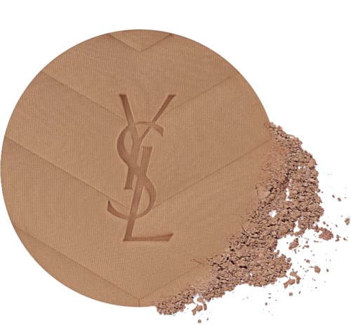 A compact pressed powder in a YSL logo design, with some powder spilled outside.