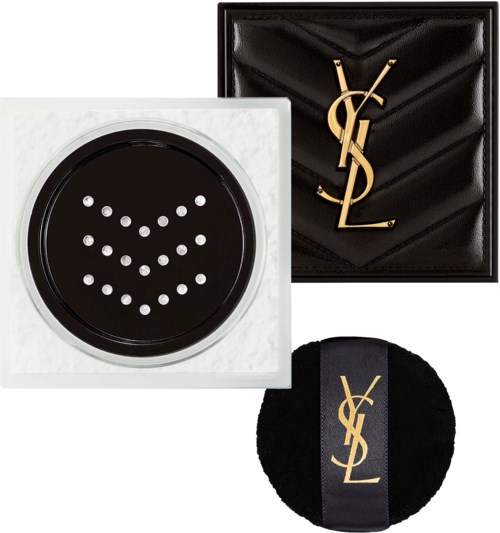 YSL-logo laatikko, musta pyöreä puuteripannu YSL-logolla ja laite, jossa valkoiset pisteet muodostavat sydämen.