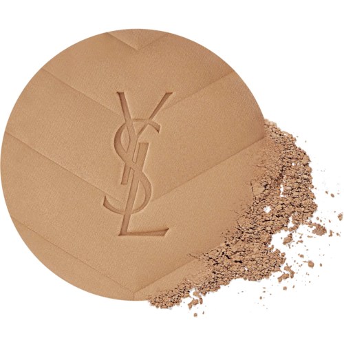 Pyöreä meikkipuuterapakkaus Yves Saint Laurent -logolla, hieman puuteria tippunut.