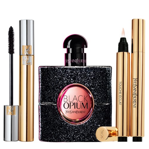 Een verzameling Yves Saint Laurent make-upproducten met gouden en zwarte verpakking, inclusief mascara, parfum, concealer en lippenstift.