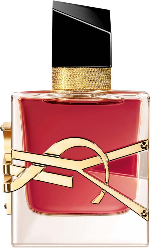 A perfume bottle with a gold strap decoration, black cap, and pink liquid inside.