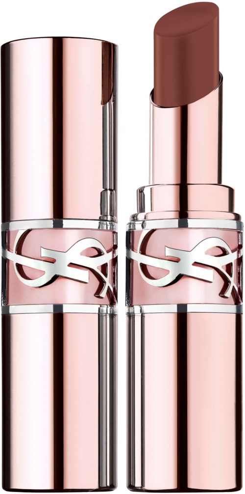 A lipstick with a pink case and a brown shade, standing against a black background.