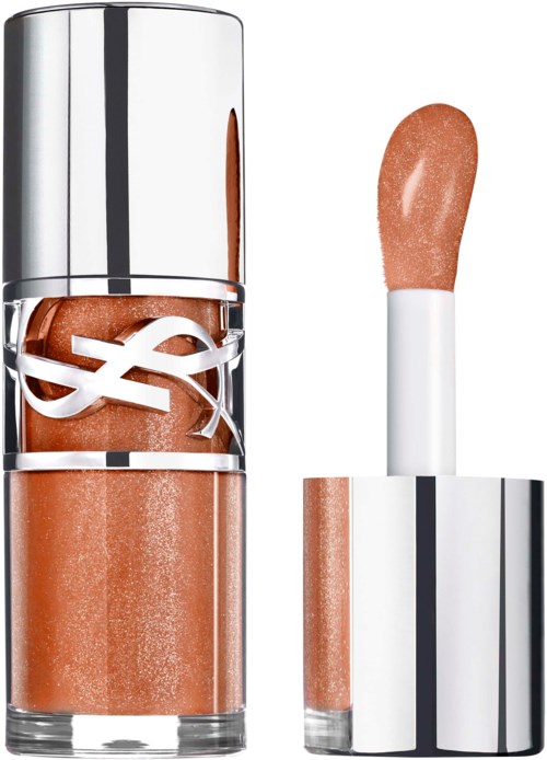 A shiny silver bottle of lip gloss and a separate sponge applicator with peachy color.