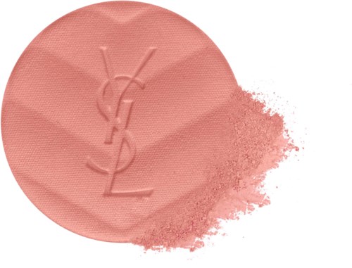 A round pink blush with the Yves Saint Laurent logo, some powder spilled nearby.