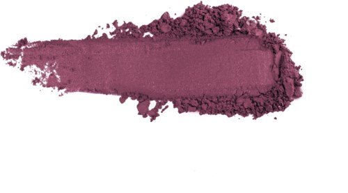 A swatch of purple powder, spread out and broken at the edges, on a white background.