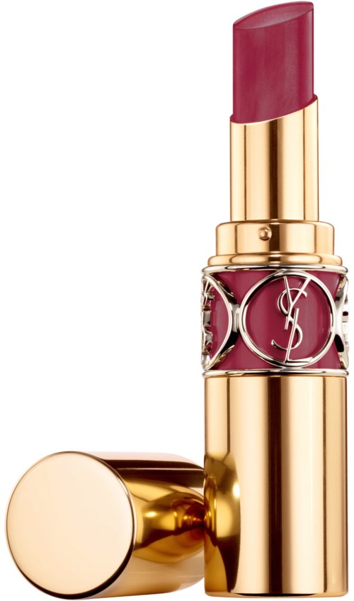 Guld- och rosa läppstift med en dekorativ band, stående upprätt, med locket av och placerat bredvid.