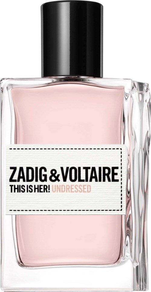 Ein Parfümflasche mit rosa Flüssigkeit, schwarzem Deckel und einem Etikett, das sagt Zadig & Voltaire This Is Her!.