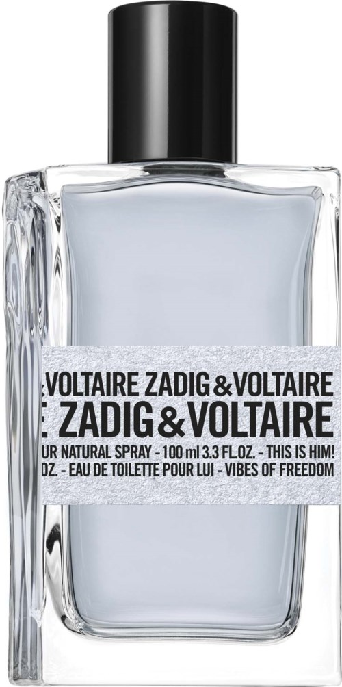 Ein klarer Glas-Parfümflasche mit schwarzem Deckel, beschriftet 'VOLTAIRE ZADIG & VOLTAIRE' und 'VIBES OF FREEDOM.'