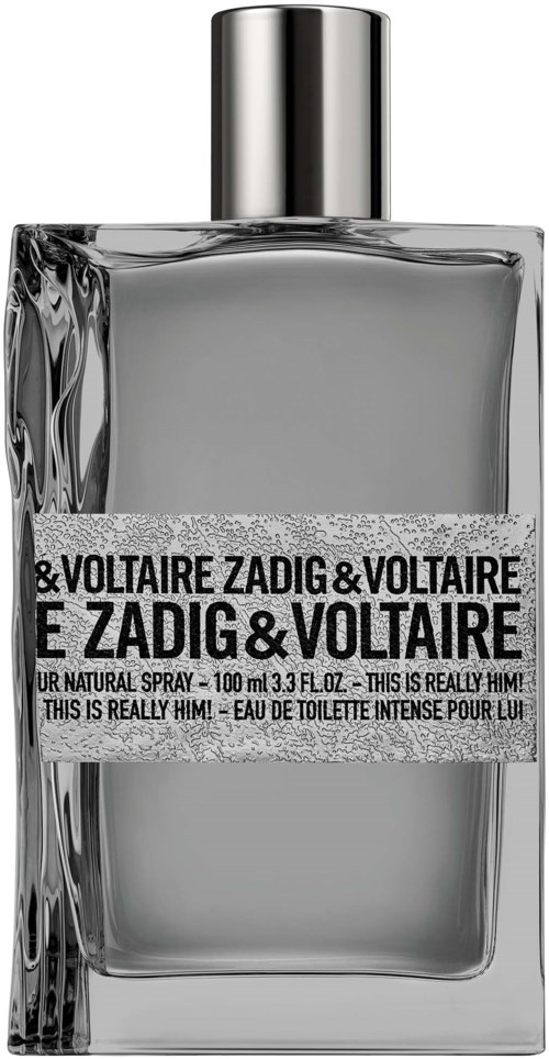 Eine rechteckige Parfümflasche mit silberner Kappe und einem Etikett mit der Aufschrift 'E Zadig & Voltaire'.