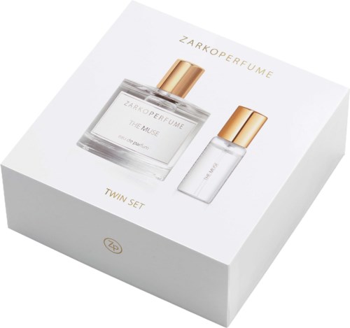 En vit låda med guldlock som innehåller en parfym och en mindre flaska, märkt Zarkoperfume Twin Set.