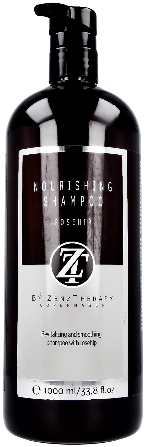 Eine schwarze Flasche mit nährendem Shampoo mit Pumpkopf, beschriftet mit Markeninformationen in weißem Text.