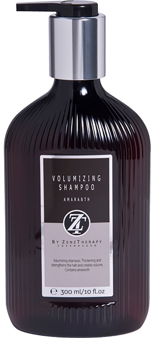 Dunkle Flasche mit Volumen-Shampoo, silberner Pumpe und weißem Etikett. Auf dem Etikett steht Text über den Zweck und die Marke des Shampoos.