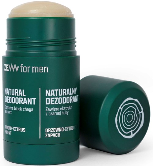 En grön deodorantstångbehållare med vitt text och en träringsdesign på locket.