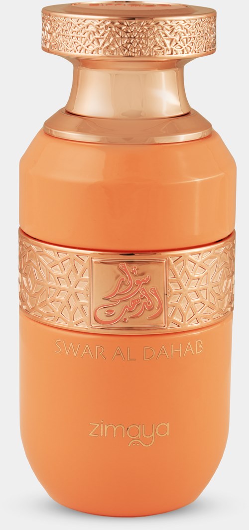 Een perzikkleurige parfumfles met gouden accenten en ingewikkelde patronen, gemerkt 'Swar Al Dahab' en 'Zamya.'