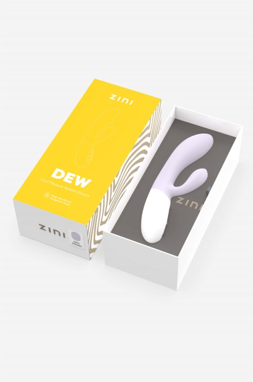 Ein weißes Gerät mit einer gebogenen Form in einer Box, mit gelber und weißer Verpackung mit "DEW" und "Zini".