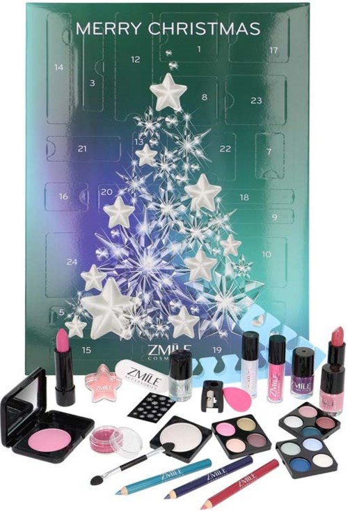 Jul-inspirerade makeup- och hudvårdsprodukter inklusive läppstift, ögonskuggor, borstar och en liten spegel framför ett adventskalender.