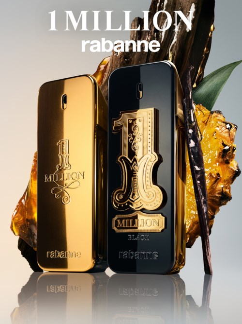 Två parfyllflaskor, en i guld och en i svart, med 1 Million Rabanne-etikett, dekorerade med ananas och vaniljstavar.