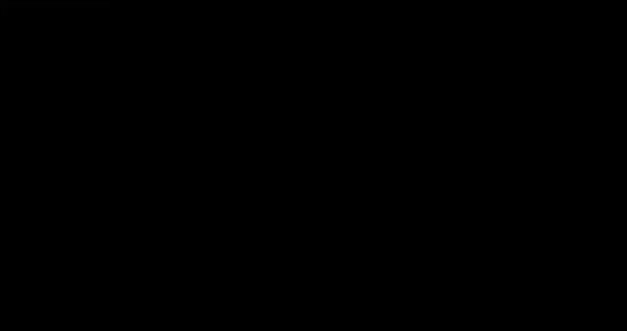 En svart-hvitt logo med et stilisert bilde av et ulvehode og noe tekst.